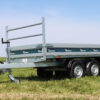 Open country landscape with the Debon PW1.2 Rear Tipper Trailer set in a field.