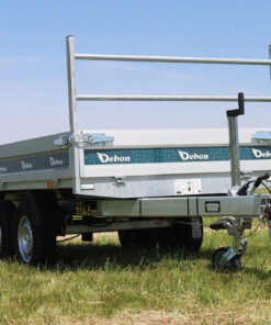 The Debon pw1 2 electric tipper trailer in a field.